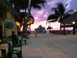 Nan in front of the fishermen's memorial photographing an Isla Holbox sunset