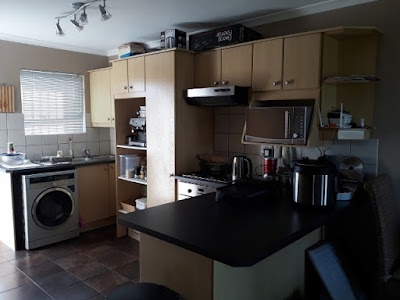 Large Kitchen with built-in-cupboards and tiled floors