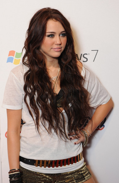 curly hairstyles with bangs. miley cyrus haircut 2010.