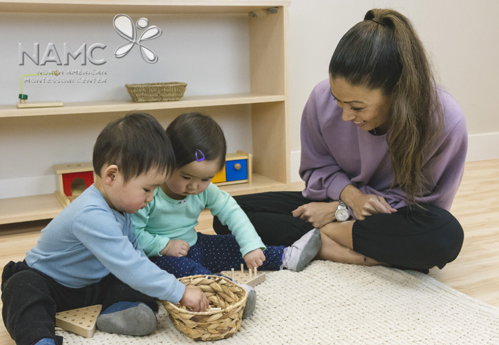 NAMC montessori purpose of play two toddlers playing