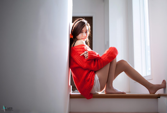 Kim Ha Yul in red sweater and white shorts