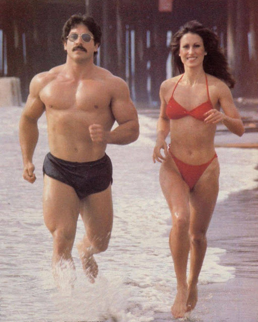 Ray Mentzer and Rachel McLish running on the beach in California