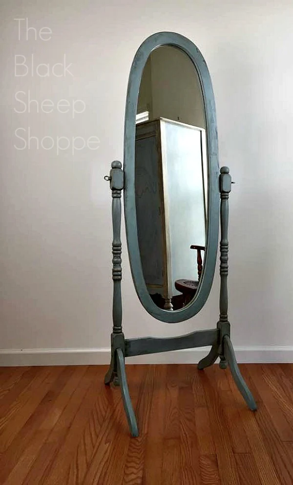 Cheval mirror given an antiqued finish