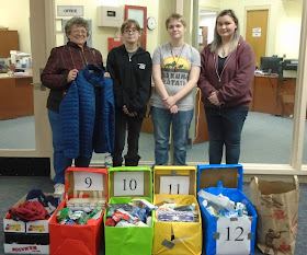 Fran Costa meets with Tri-County students Ashley O’Handley, Hannah Galante, and Damaris Carter, to organize items donated by the Tri-County community for homeless veterans