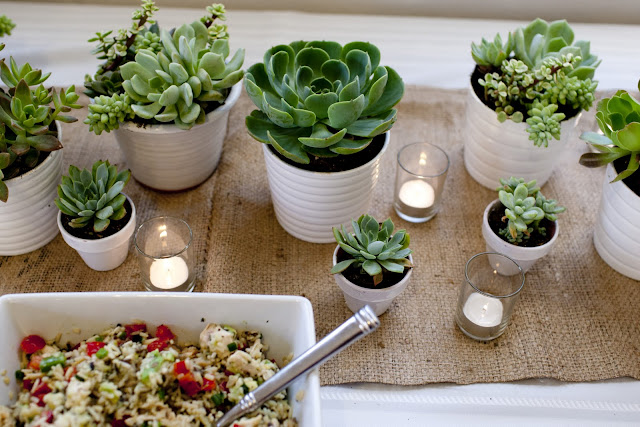  of flowers and candles on burlap to pop against the white table cloth