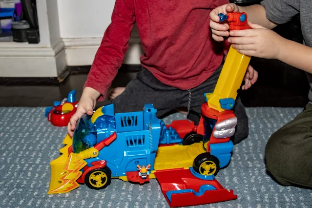 attaching the water feature to the water cannon and side view of the rescue truck including the Speedster SuperThing