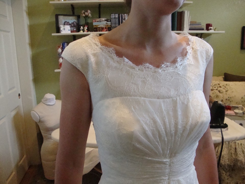  envisioned little satin buttons down the back of her wedding gown