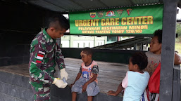 Satgas Pamtas Yonif 126/KC Berikan Pengobatan Terbaik Untuk Anak Papua