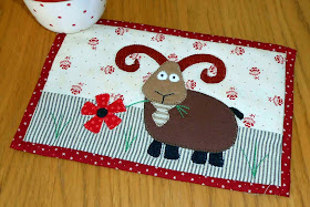http://www.craftsy.com/pattern/quilting/home-decor/billy-goat-mug-rug/89545