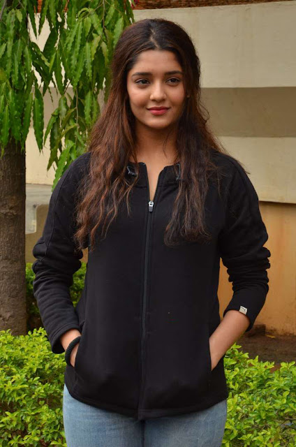 Ritika Singh exudes coolness in a black outfit, showcasing her stylish and confident demeanor.