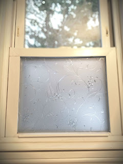 The problem was, the only thing keeping the neighbors from getting a full view of the bathroom were said blinds. So I began searching the internet, as well as my local Home Depot, and decided to buy window film.