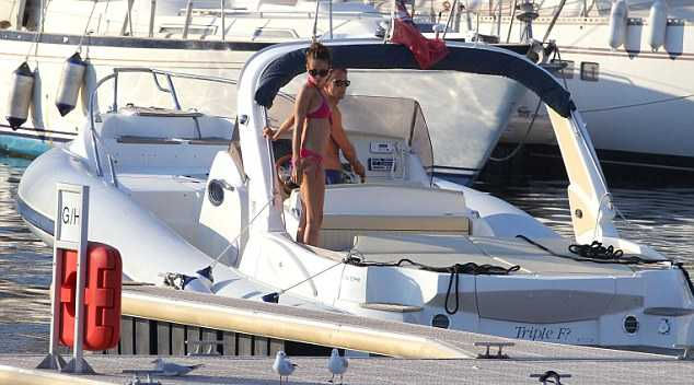 Jenson Button and girlfriend Jessica Michibata show off their toned beach 