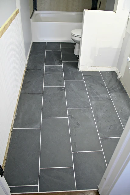 How To Tile A Bathroom Floor It S Done Thrifty Decor Diy And Organizing