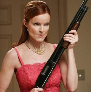 Marcia Cross holds a Winchester Model 1912 as Bree Van de Kamp in Desperate Housewives