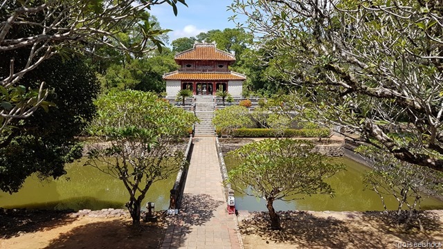 Garden with bridge leading to the Bright Pavilion.