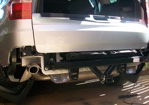 The towbar fits up behind the bumper and is bolted across the rear of 