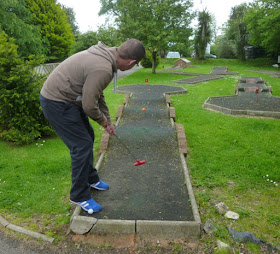 Minigolfer Richard Gottfried at the Crazy Golf course at the Thorne Park Golf Centre in Salcombe Regis, near Sidmouth, Devon