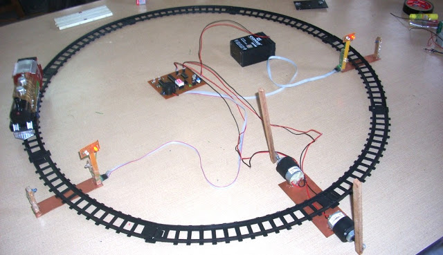 Automatic Railway Gate Control System Using AVR ATmega8  with complete project report, code and circuit diagram.