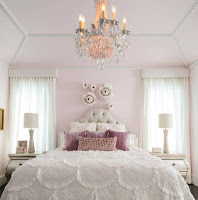 Peach pink wall color for bright bedroom design and lavender pillows