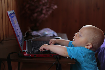 a child at a computer