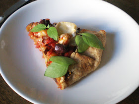 a slice of ratatouille pie with fresh lemon basil