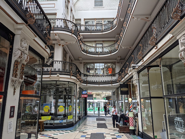 Tiled floor, ornate balconies and light open space