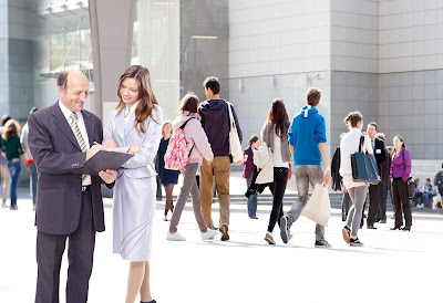 people standing or walking in an outdoor setting