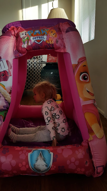 toddlers-opening-presents-inflatable-house