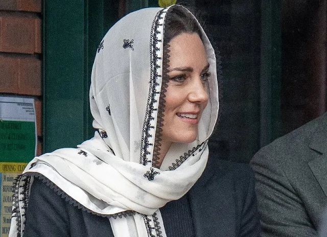 Princess Kate wore a black pleated dress by Alexander McQueen and a cream embroidered headscarf by Elan