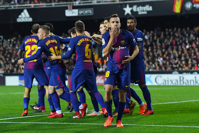 Barcelona players celebrates Alba's equalizer against Valencia