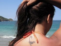 Scorpio neck tattoo woman