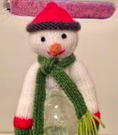 http://www.ravelry.com/patterns/library/snowman-bottle-topper