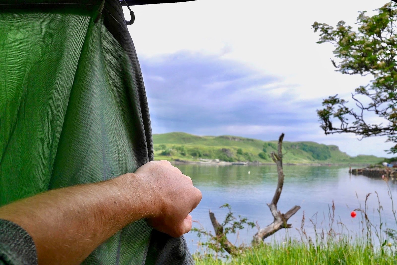 Opening my tent to show the beautiful view of the loch, www.CalMCTravels.com, The best campsites in Scotland