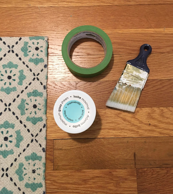 Update a boring entry way with a bright door and hand painted accent wall using a sponge! 