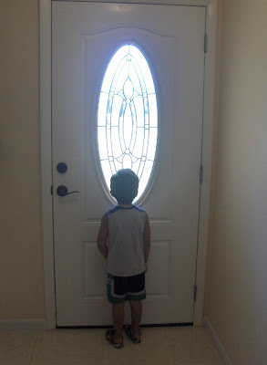 kid by door