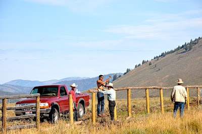 men working on fence repair