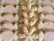 . star pink frosting filled almond cookies and pink cake pops with . (pink christmas )