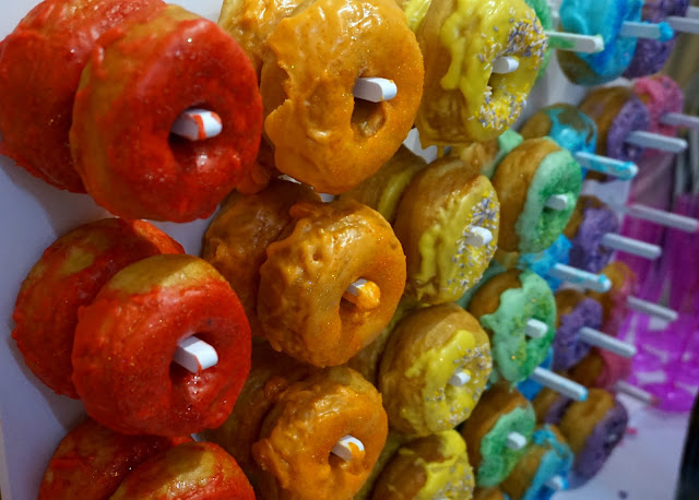 wall of rainbow doughnuts