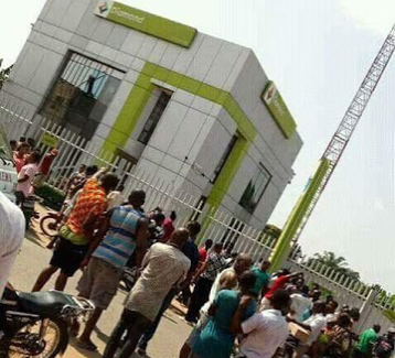 Graphic Photos: Armed robbers storm Diamond Bank in Okija, Anambra, kill school bus driver