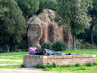 homeless man in the park near Domus Areus