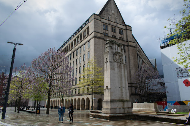 Building with row of arches covering walkway on ground floor