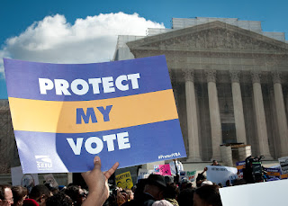 Protect My Vote sign held in front of US Supreme Court