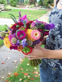 Bride bouquet, bright, Ann Arbor, Floral, Florist, Wedding, Sweet Pea Floral Design, Michigan, outdoor, earthy, once wed, 100 layer cake, indie,Orange dahlia, coral zinnia, fuchsia anemone, purple sweet pea, red cockscomb, red and green ranunculus, scabiosa pods, english lavender, and veronica