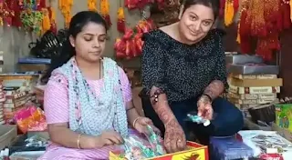 two women with rakhi
