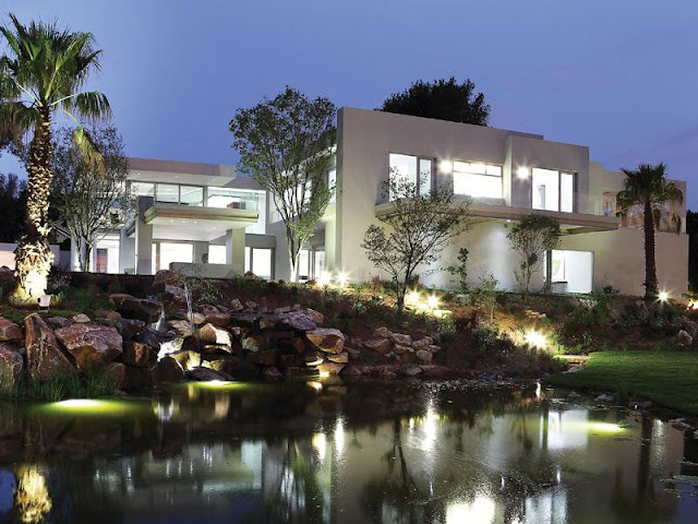Modern Luxury House In Johannesburg at night from the lake 