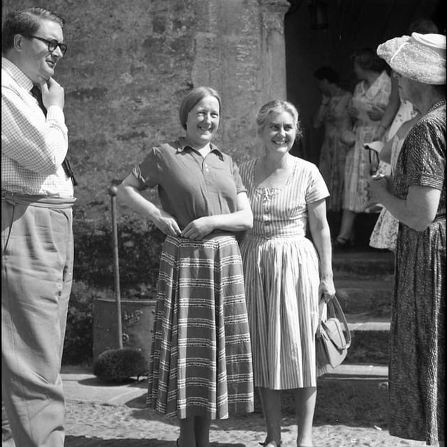 Imogen Holst, a key figure in the history of Dartington's Summer School, outside the Great Hall at Dartington in 1959 with B. Edwards, John Edwards (far left) and Dorothy Elmhirst (far right). Photo credit: Catharine Scudamore, courtesy of the Dartington International Summer School Foundation.