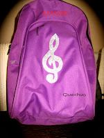 Mochila clave sol purpurina