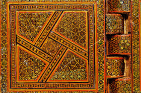 Detail of the decorative inlay pattern of gold stars on an Iranian Qur'an book stand