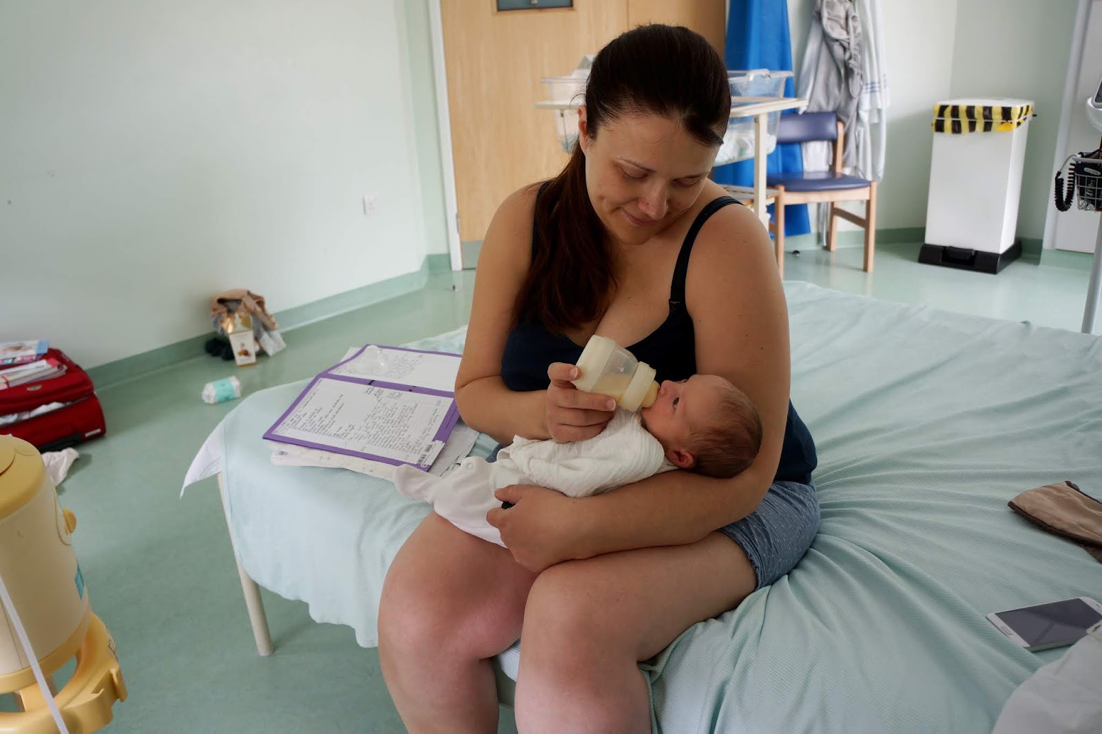 mother bottlefeeding in a hospital