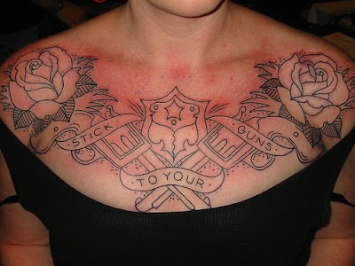 Guns and roses chest tattoo idea for women